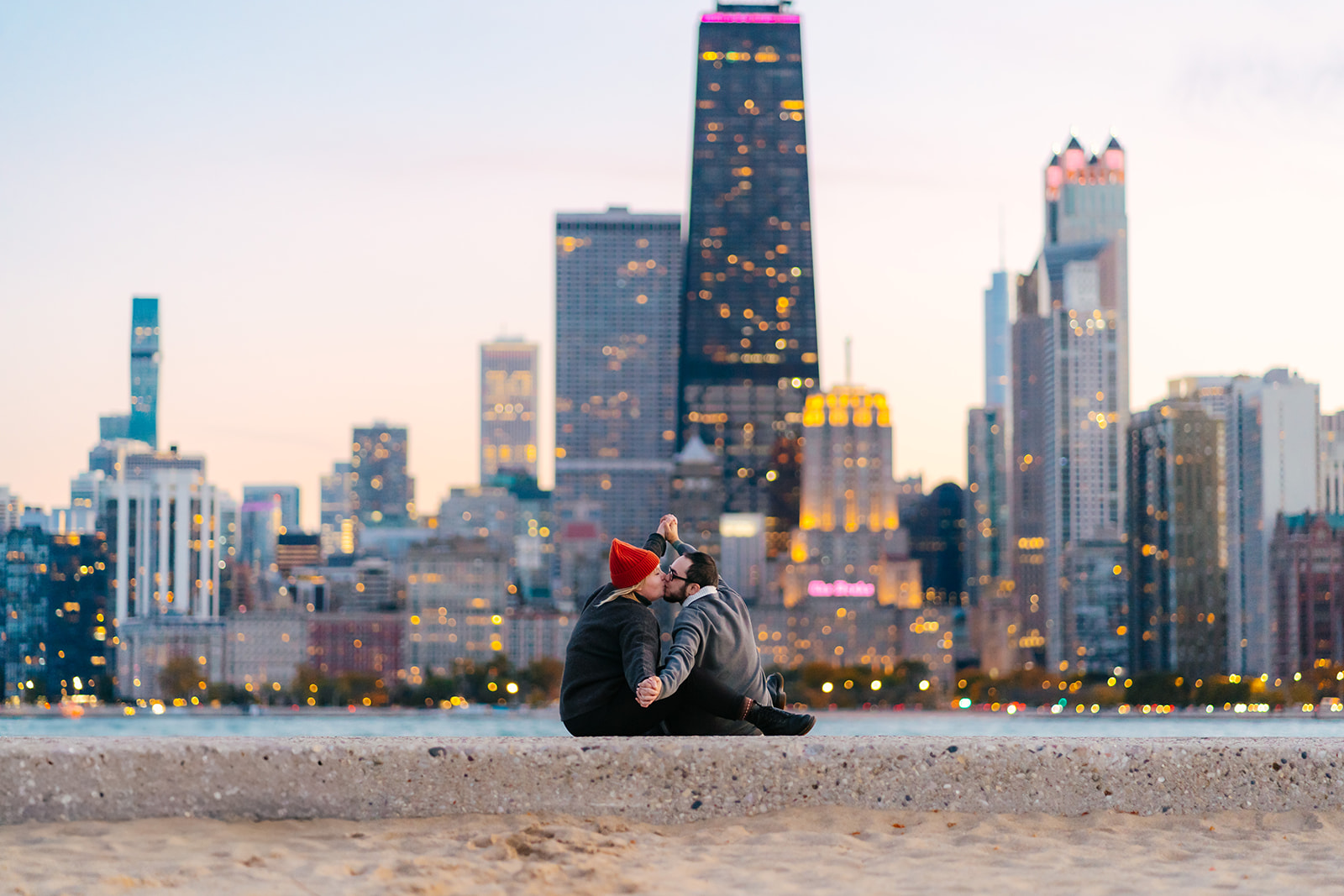 queer couple kissing on pier at north ave beach in chicago, illinois