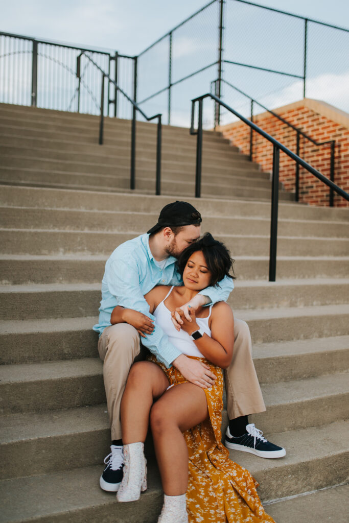 michigan photographer posing with her husband at golden hour