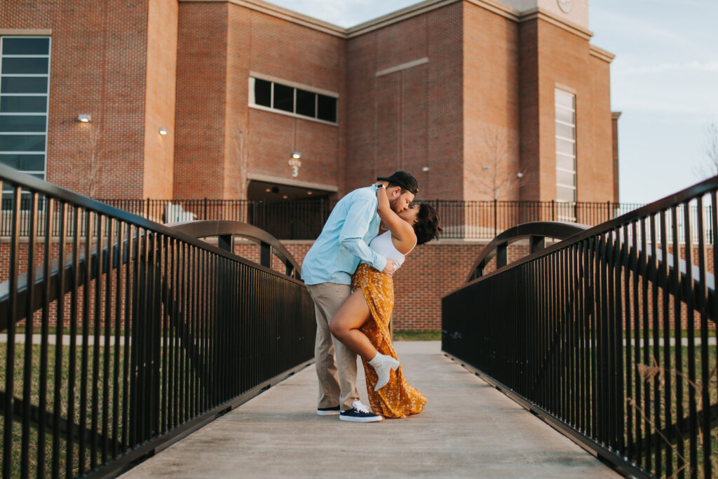 couple shares a kiss during sunset in the midwest