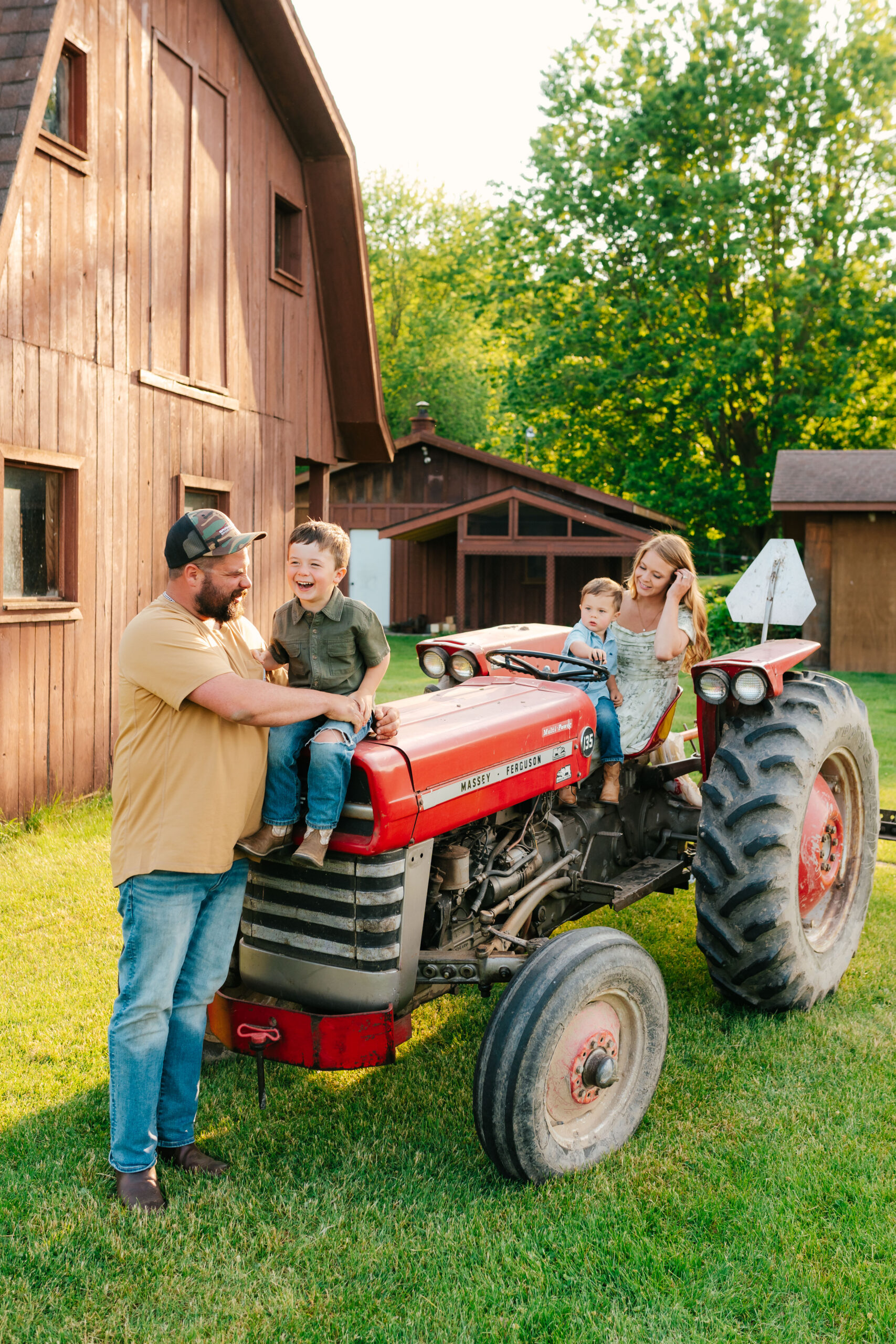 family photos ideas on a farm with a tractor in grand rapids, michigan during golden hour