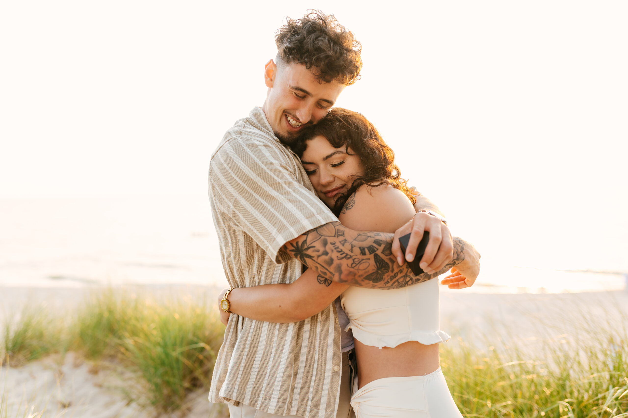 Proposal photographer capturing the moment of the couple embracing